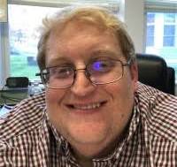 This image has an empty alt attribute; its file name is aaron.jpg